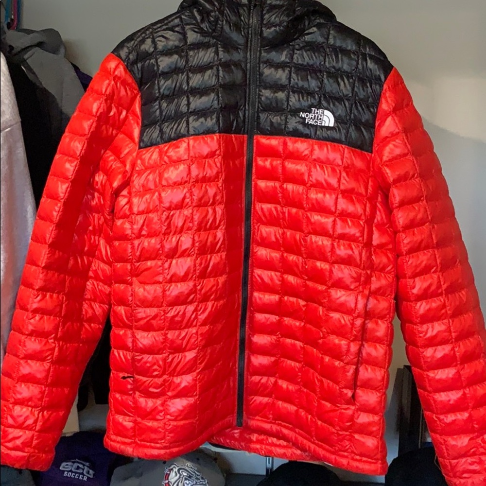 Red north face jacket or puffer